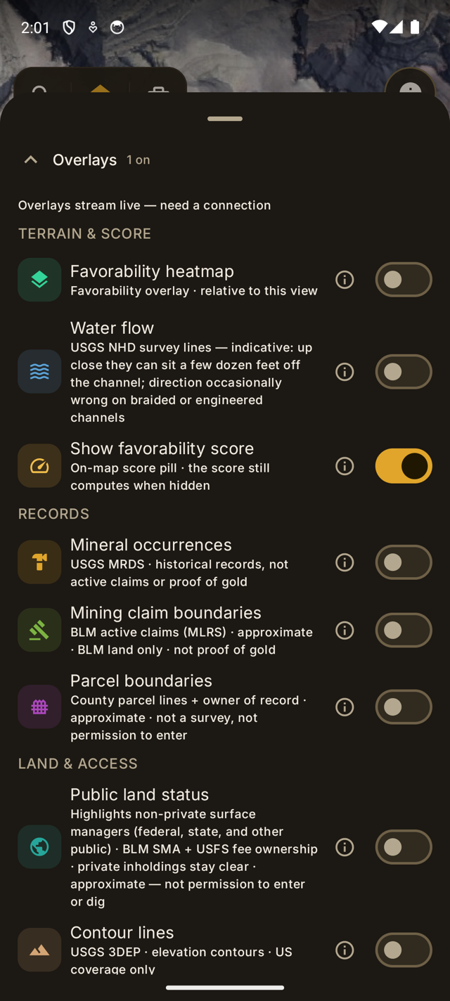 Lodeline's Overlays panel: favorability heatmap, water flow, MRDS mineral occurrences, BLM mining-claim boundaries, parcel boundaries, and public-land status toggles with honest MRDS framing.